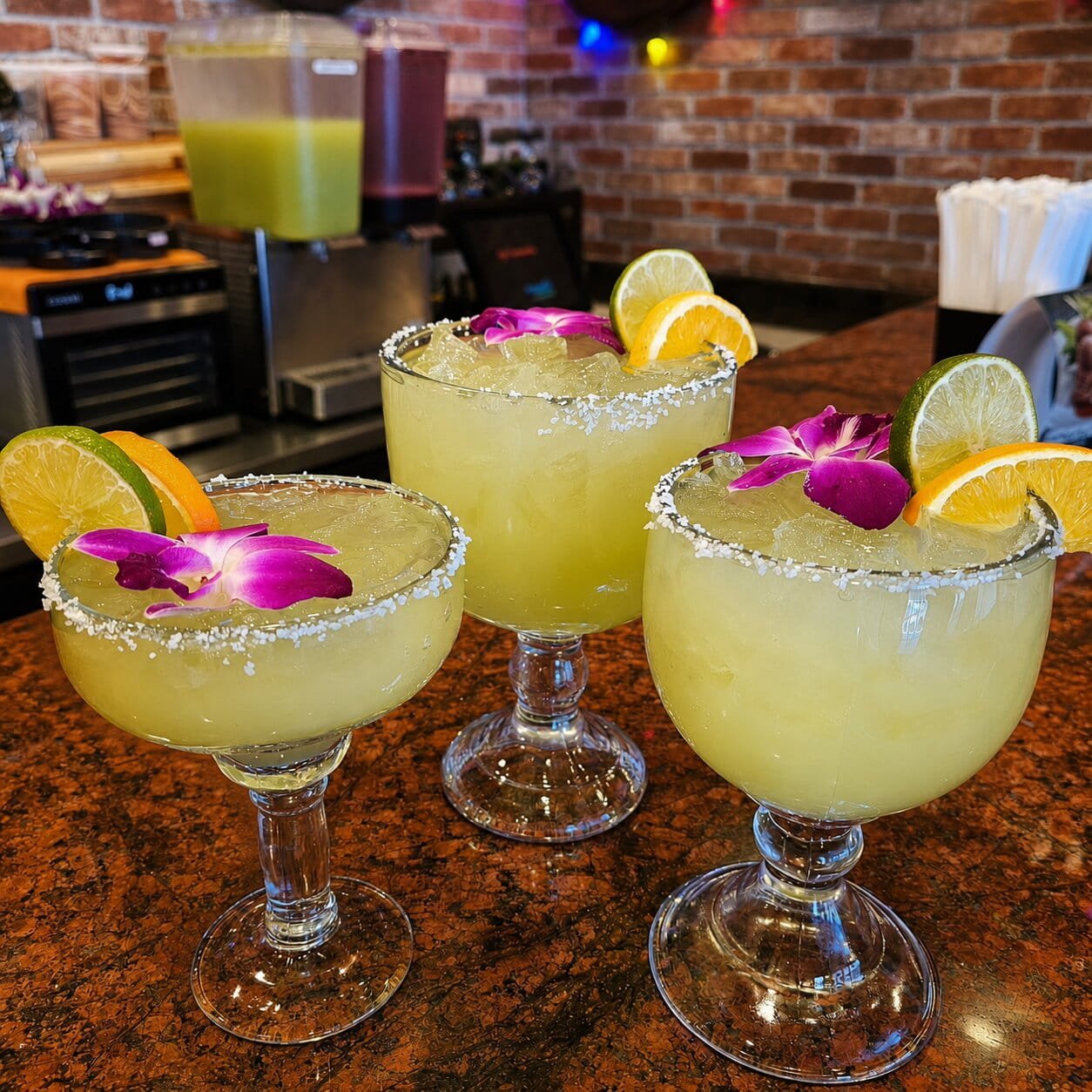 Tropical margaritas served at the bar at Ay Caramba